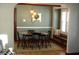 Inviting dining room with an oval table, statement lighting, and a window nook at 6041 Dewey Ave, Indianapolis, IN 46219