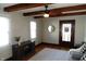 Inviting living room featuring ceiling fan, front door, two windows, hardwood floors and neutral décor at 6041 Dewey Ave, Indianapolis, IN 46219