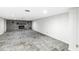 Finished basement featuring stone fireplace and ceramic tile flooring at 671 Spring Hills Dr, Zionsville, IN 46077