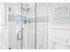 Bright bathroom showcasing a tiled glass shower with a built-in niche and a toilet at 671 Spring Hills Dr, Zionsville, IN 46077