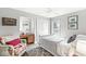Charming bedroom featuring a patterned rug, vintage chair, and ample natural light at 671 Spring Hills Dr, Zionsville, IN 46077