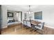 Open dining area featuring hardwood flooring, and seamless flow into adjacent living spaces at 671 Spring Hills Dr, Zionsville, IN 46077