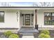 Front porch features a unique glass block window, providing a modern look and natural light at 671 Spring Hills Dr, Zionsville, IN 46077