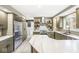Modern kitchen featuring stainless steel appliances, a stylish backsplash, and sleek countertops at 671 Spring Hills Dr, Zionsville, IN 46077