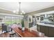 Bright kitchen with an island, stainless steel appliances, and a view to the backyard and living room at 671 Spring Hills Dr, Zionsville, IN 46077