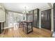 Eat-in kitchen with a unique bar, hardwood floors, stylish lighting, and backyard access at 671 Spring Hills Dr, Zionsville, IN 46077