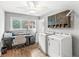Functional laundry room and office space featuring modern appliances, ample storage, and natural light at 671 Spring Hills Dr, Zionsville, IN 46077