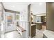 Convenient mudroom featuring custom built-in bench and hooks, leading to the outdoor deck at 671 Spring Hills Dr, Zionsville, IN 46077