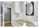 Well-lit bathroom with white tile and cabinet at 7133 Mc Lain Dr, Indianapolis, IN 46217