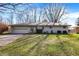 Charming ranch-style home featuring a one car garage, light brick, and well maintained lawn and landscape at 7133 Mc Lain Dr, Indianapolis, IN 46217