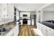 Charming kitchen featuring stainless steel appliances, white cabinets, and durable countertops at 7133 Mc Lain Dr, Indianapolis, IN 46217