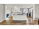 Bright and open-concept kitchen features white cabinetry and view to the adjacent dining area at 7133 Mc Lain Dr, Indianapolis, IN 46217