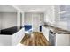 Well-lit kitchen boasting stainless steel appliances, light cabinetry and view to open living spaces at 7133 Mc Lain Dr, Indianapolis, IN 46217