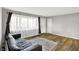 Inviting living room with new floors, a large window, fresh paint and a comfortable couch at 7133 Mc Lain Dr, Indianapolis, IN 46217