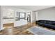 Open-concept layout connecting the living room and kitchen with stainless steel appliances at 7133 Mc Lain Dr, Indianapolis, IN 46217
