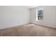 Simple bedroom with neutral carpet and window allowing natural light at 7164 Long Shore Cir, Indianapolis, IN 46217