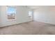 Bright bedroom with two windows providing ample natural light and carpeted flooring at 7164 Long Shore Cir, Indianapolis, IN 46217