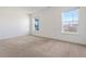 Spacious, bright bedroom with two large windows and carpeted flooring, offering a comfortable living space at 7164 Long Shore Cir, Indianapolis, IN 46217