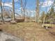 Spacious backyard featuring a bench, sturdy fencing, and ample room for outdoor activities at 7540 S Mooresville Rd, Indianapolis, IN 46221