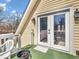 Balcony area featuring a sliding glass door, green painted floor, and a chair at 7540 S Mooresville Rd, Indianapolis, IN 46221