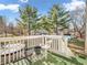Balcony overlooking the backyard area with patio furniture, greenery, and an overhead sky view at 7540 S Mooresville Rd, Indianapolis, IN 46221