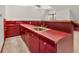 Bar sink area with wood countertops and red cabinets at 7540 S Mooresville Rd, Indianapolis, IN 46221