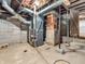 Basement with exposed brick and a modern furnace at 7540 S Mooresville Rd, Indianapolis, IN 46221