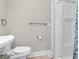 Bathroom with white toilet, walk-in shower and heated towel rack at 7540 S Mooresville Rd, Indianapolis, IN 46221