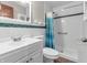 Bathroom featuring a shower, toilet, and vanity with sink at 7540 S Mooresville Rd, Indianapolis, IN 46221