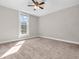 Bedroom with a window, carpet and a ceiling fan at 7540 S Mooresville Rd, Indianapolis, IN 46221