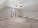 Bedroom featuring neutral walls and carpet, a window, and a ceiling fan with light fixture at 7540 S Mooresville Rd, Indianapolis, IN 46221