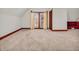 Carpeted bonus room with natural light, window and trim at 7540 S Mooresville Rd, Indianapolis, IN 46221