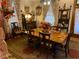 Charming dining room featuring a wood table, decorative accents, and a colorful stained glass light fixture at 7540 S Mooresville Rd, Indianapolis, IN 46221