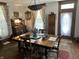 Cozy dining room has a wooden table, floral curtains, and stylish decor at 7540 S Mooresville Rd, Indianapolis, IN 46221