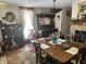 Elegant dining room features a wooden table, floral curtains, and unique decorative pieces at 7540 S Mooresville Rd, Indianapolis, IN 46221