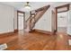 Open entryway with original wood trim, staircase and hardwood floors at 7540 S Mooresville Rd, Indianapolis, IN 46221