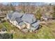 Aerial view of the exterior elevation with a view of the home's large yard and trees at 7540 S Mooresville Rd, Indianapolis, IN 46221