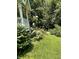 Well-maintained front yard and lush landscaping, with a charming front porch at 7540 S Mooresville Rd, Indianapolis, IN 46221