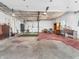Functional garage interior featuring ample storage space, shelving, and a convenient side entrance at 7540 S Mooresville Rd, Indianapolis, IN 46221