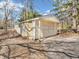 Detached one car garage with a classic design, featuring a paved driveway at 7540 S Mooresville Rd, Indianapolis, IN 46221