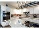 Bright kitchen boasts stainless appliances, granite countertops, and ample storage space in the cabinets at 7540 S Mooresville Rd, Indianapolis, IN 46221
