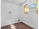 Laundry room with vinyl flooring, a window, and white walls at 7540 S Mooresville Rd, Indianapolis, IN 46221