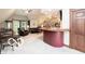 Spacious living area showcasing a wet bar, comfortable seating, and natural light at 7540 S Mooresville Rd, Indianapolis, IN 46221
