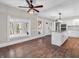 Open-concept living room and kitchen area with hardwood floors and ample natural light at 7540 S Mooresville Rd, Indianapolis, IN 46221