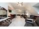 Open-concept living room featuring a wet bar, neutral carpet, and comfortable seating area at 7540 S Mooresville Rd, Indianapolis, IN 46221