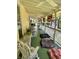 Inviting covered porch furnished with rocking chairs, cozy seating, and decorative accents at 7540 S Mooresville Rd, Indianapolis, IN 46221