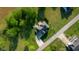 Aerial view showcases the home, lush greenery, and a well-manicured lawn in a desirable neighborhood at 7845 W Hillside Dr, Columbus, IN 47201