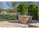 Stone fire pit with comfortable seating in the backyard at 7845 W Hillside Dr, Columbus, IN 47201