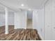 Finished basement with wood-look floors and a staircase at 7845 W Hillside Dr, Columbus, IN 47201