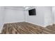 Finished basement with a flat screen television and luxury vinyl floors at 7845 W Hillside Dr, Columbus, IN 47201